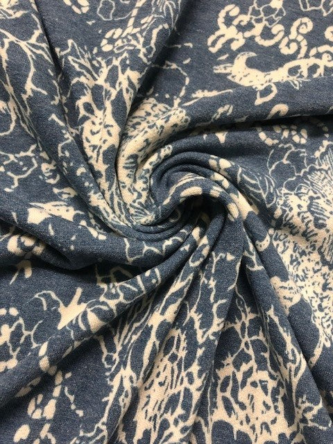 Blue & Ivory Floral Jersey Fabric – Soft Stretch for Stylish Garments