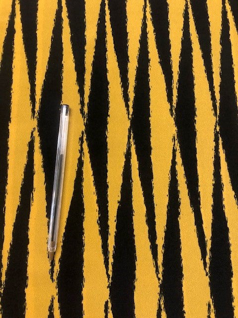 Black & Yellow Aztec Style Print. 100% Polyester. 145cm, 115g/m2. Roll Size 2.7m