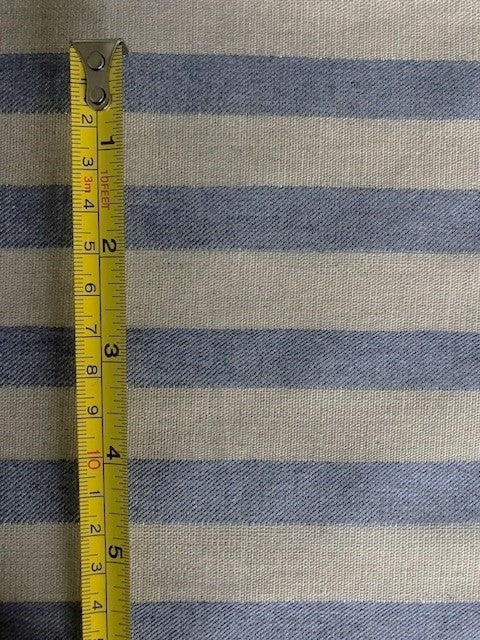 Sky Blue Twill Stripe With Silver Lurex Detail. Stripes Run Across The Fabric