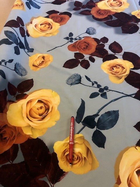 Yellow Rose on Sage Green Scuba Crepe. 200g/m2, 95% Polyester 5% Elastane. Roll Size - 6.8m