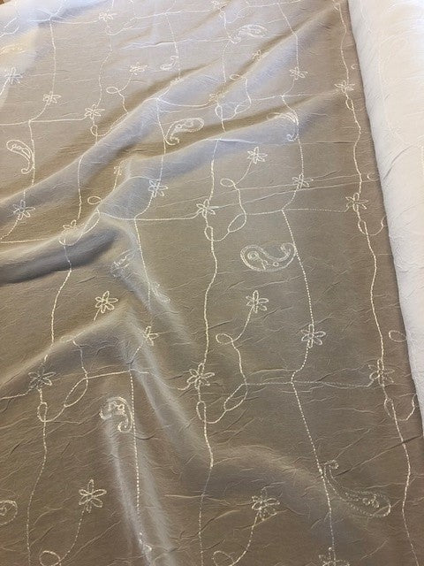 Ivory Flower and Paisley Embroidery on Crinkle Chiffon. 70g/m2, 100% Polyester. Roll Size: 4.5m