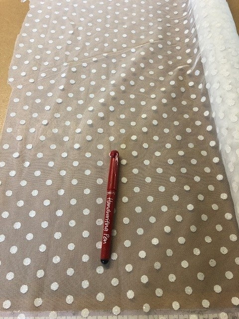 Ivory Glitter Spot on Tulle. 70g/m2, 100% Polyester. Roll Size: 1.5m