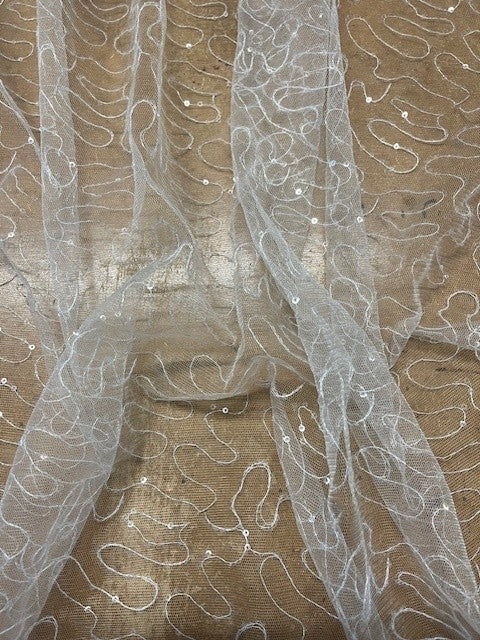 Ivory Tulle With Embroidery and Clear Sequin. 80g/m2, 100% Polyester. Roll Size: 1.9m