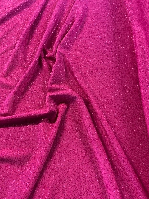 Cerise Glitter on Jersey. 220g/m2, 95% Polyester 5% Elastane. Roll Size: 3.6m