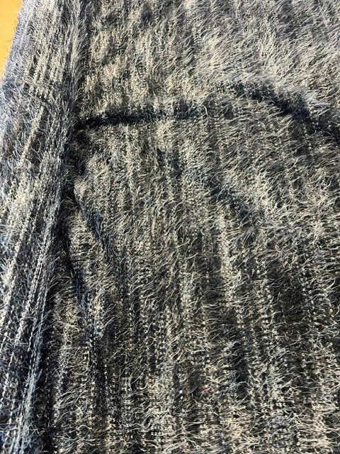 Tones of Grey and Black Soft Handle Tassel Knit. 100% Polyester, 130g/m2, 145cm Wide. Roll Size: 2m.