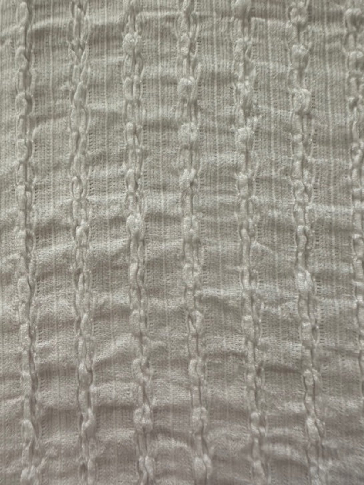 Ivory Textured Irregular Self Colour Stripe. Stripes run along the fabric.