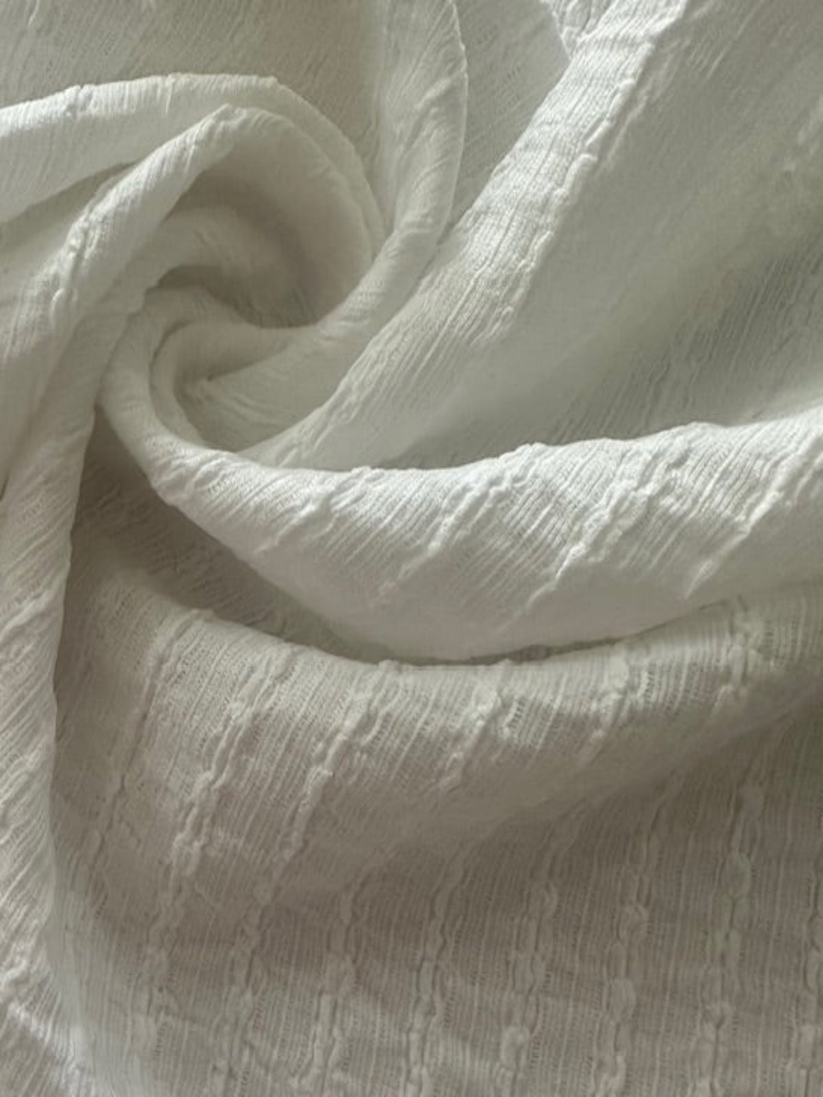Ivory Textured Irregular Self Colour Stripe. Stripes run along the fabric.