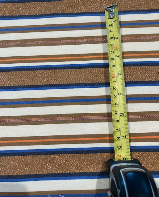 Bronze & Blue Woven Stripe with Lurex Detail. One Way Stretch. Stripes run across the fabric.