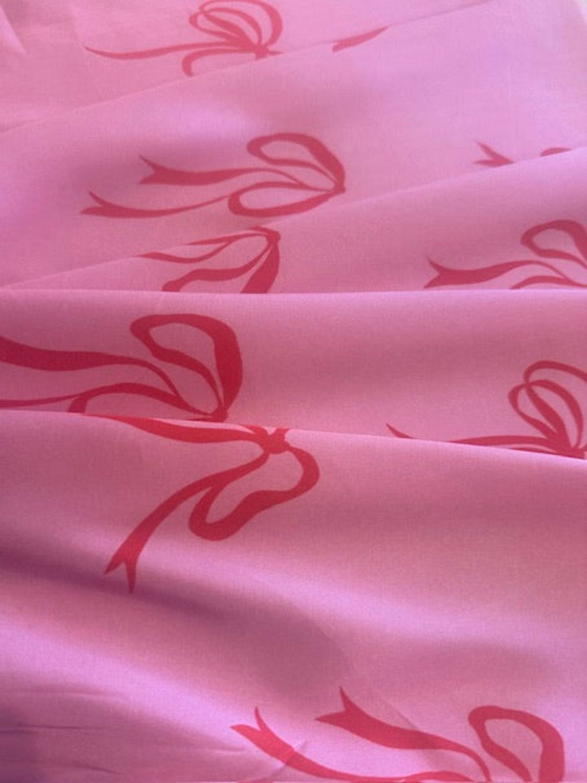 Red Bows on Bright Pink Satin Finish One Way Stretch Cotton