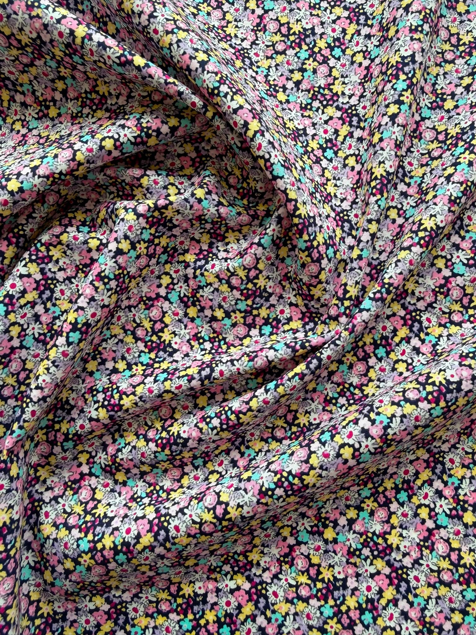 112cm Wide Multicoloured Ditzy Floral Cotton Fabric on Black – 100% Cotton