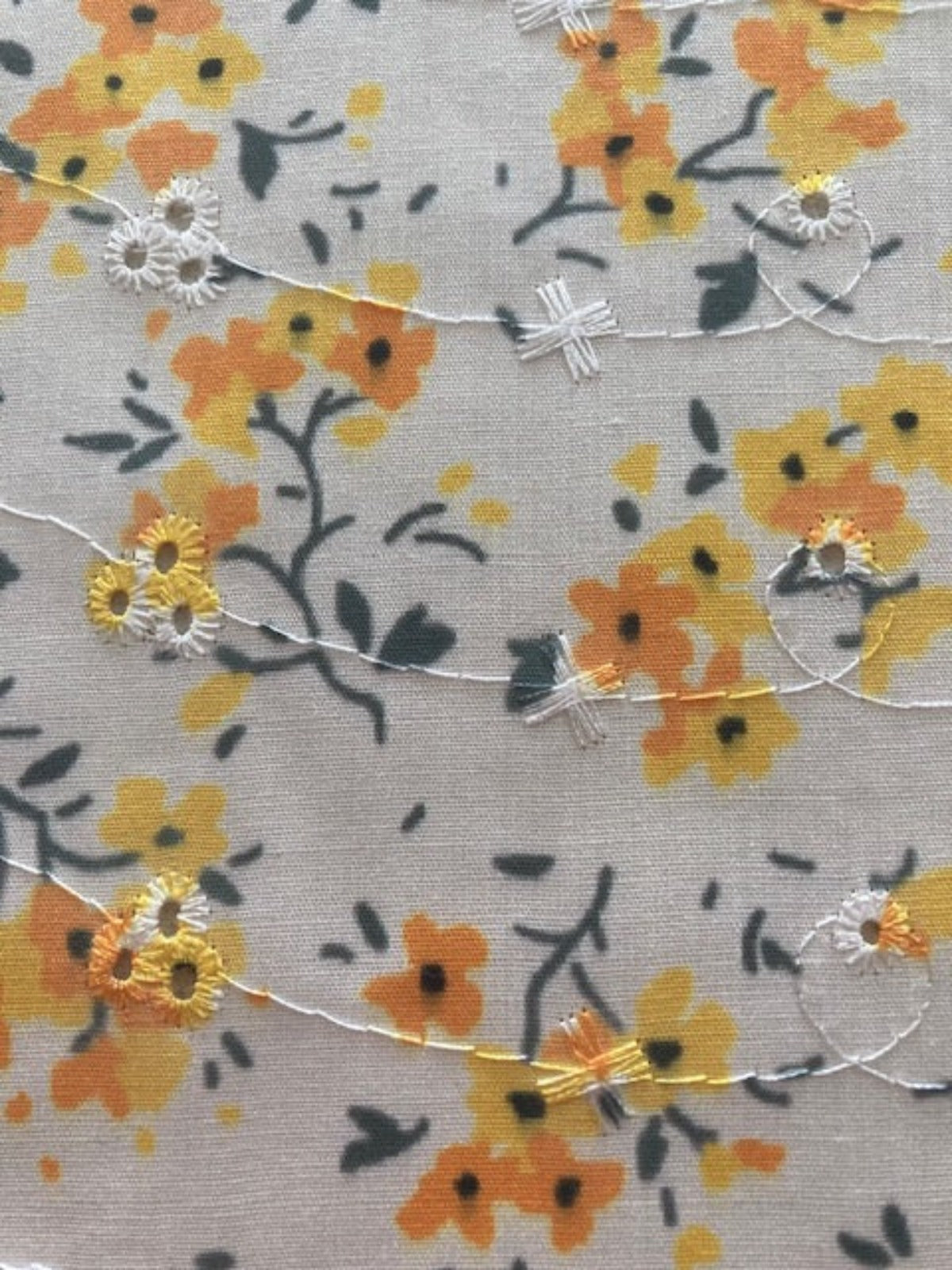 Orange Flower Bunches on Ivory Broderie Anglaise Fabric
