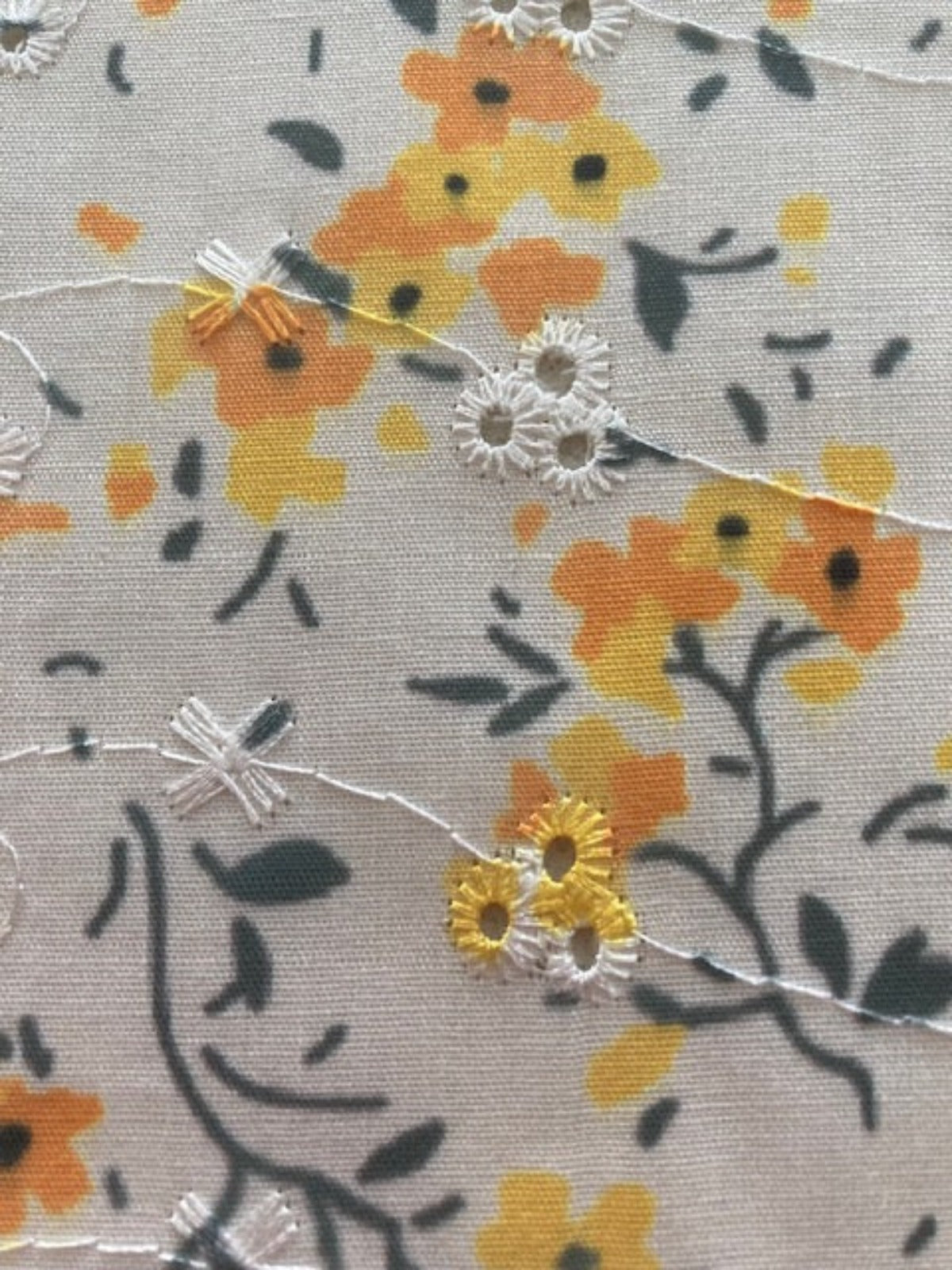 Orange Flower Bunches on Ivory Broderie Anglaise Fabric
