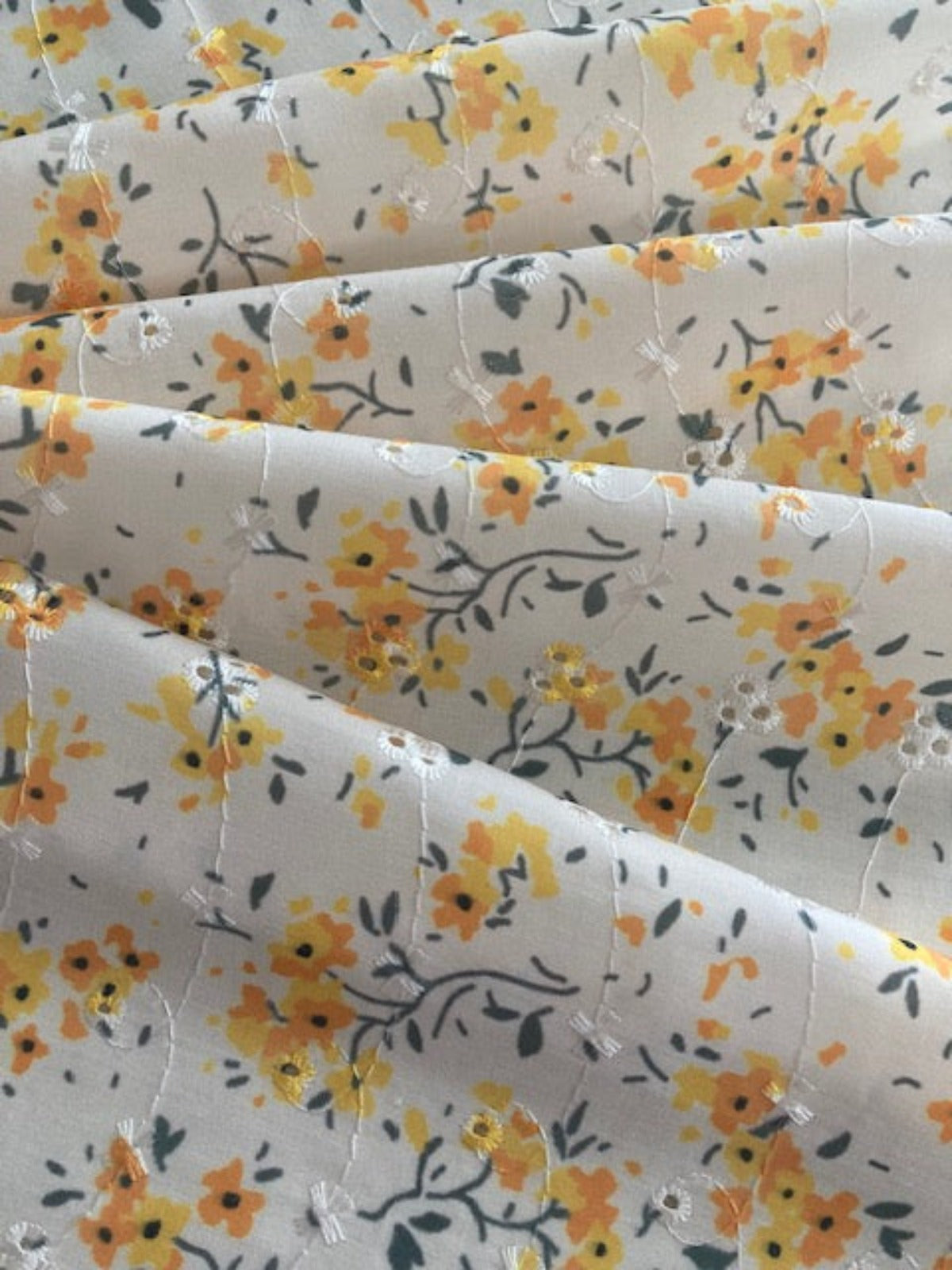 Orange Flower Bunches on Ivory Broderie Anglaise Fabric