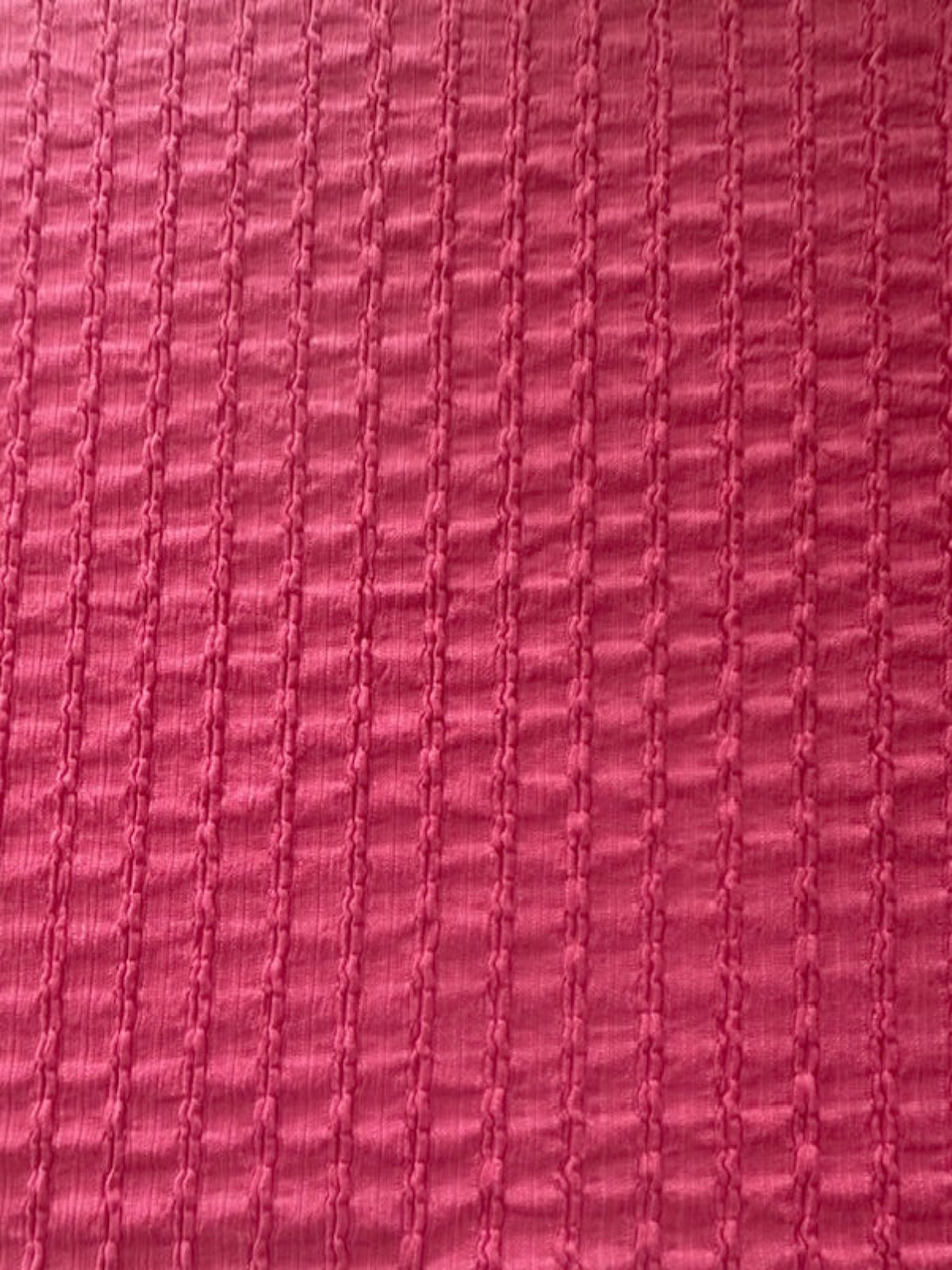 Bubble Pink Textured Irregular Self Colour Stripe. Stripes run along the fabric.