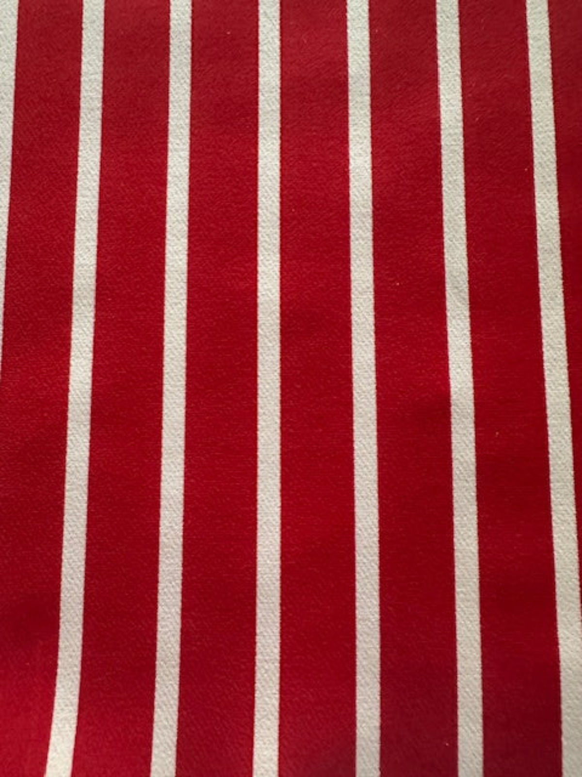 Red Butcher Stripe with stretch. Stripes run along the Fabric.