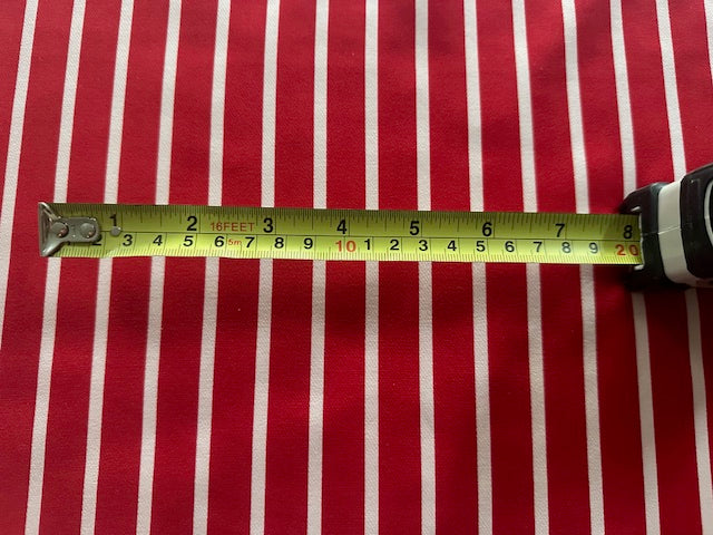 Red Butcher Stripe with stretch. Stripes run along the Fabric.