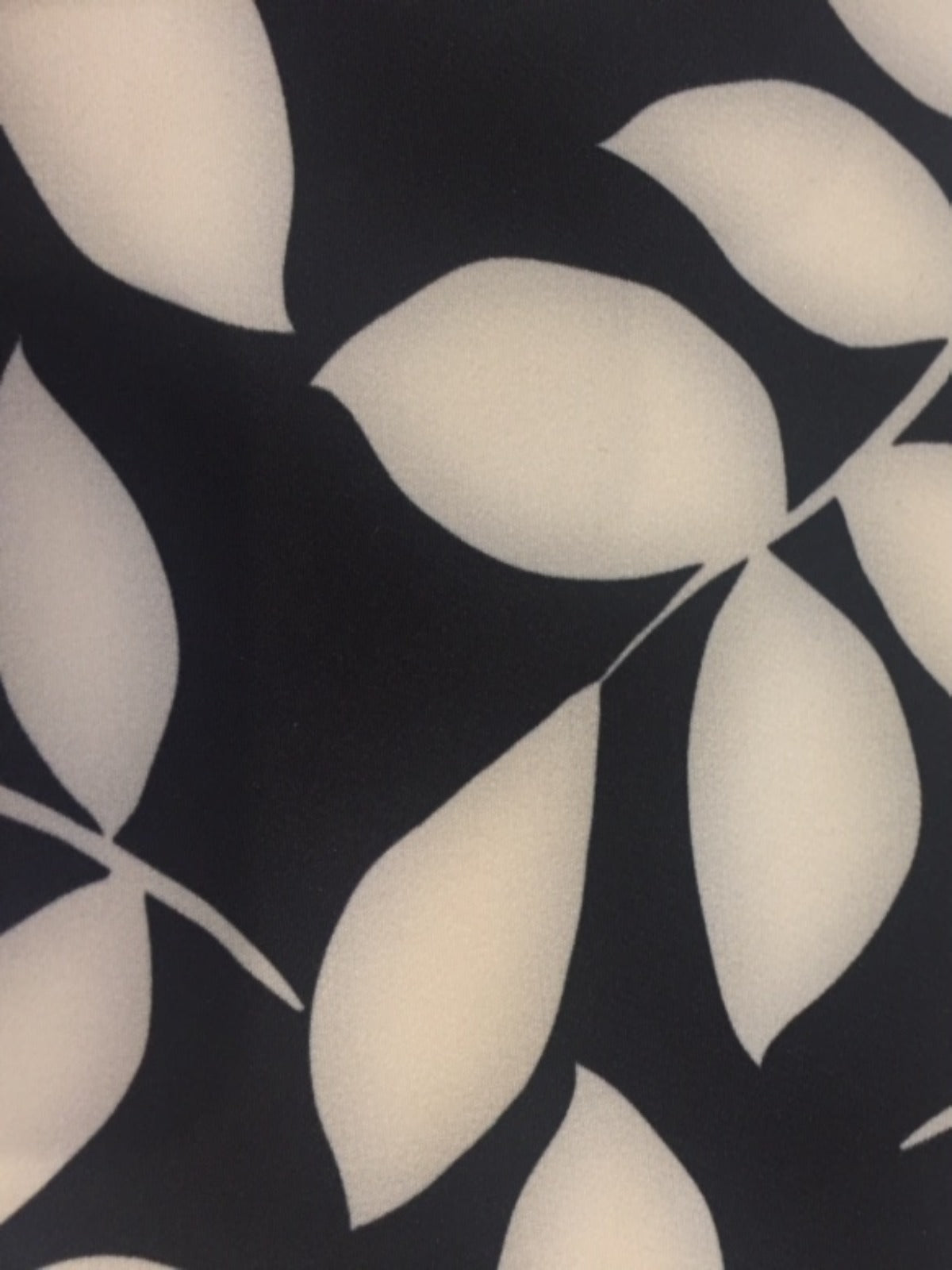 Ivory on Black Leaf Mono Print on Stretch Woven - Deadstock fabric on AmoThreads