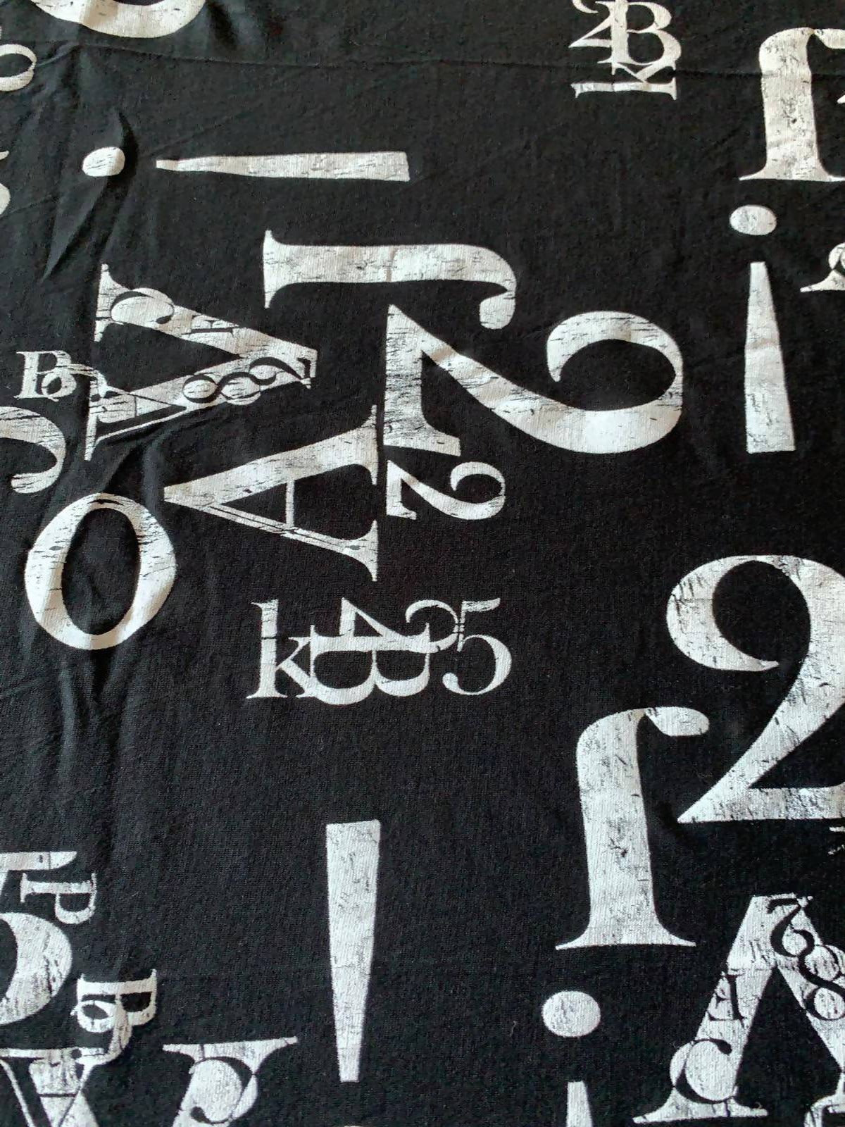 Number and Letters print on Black knit - Deadstock fabric on AmoThreads