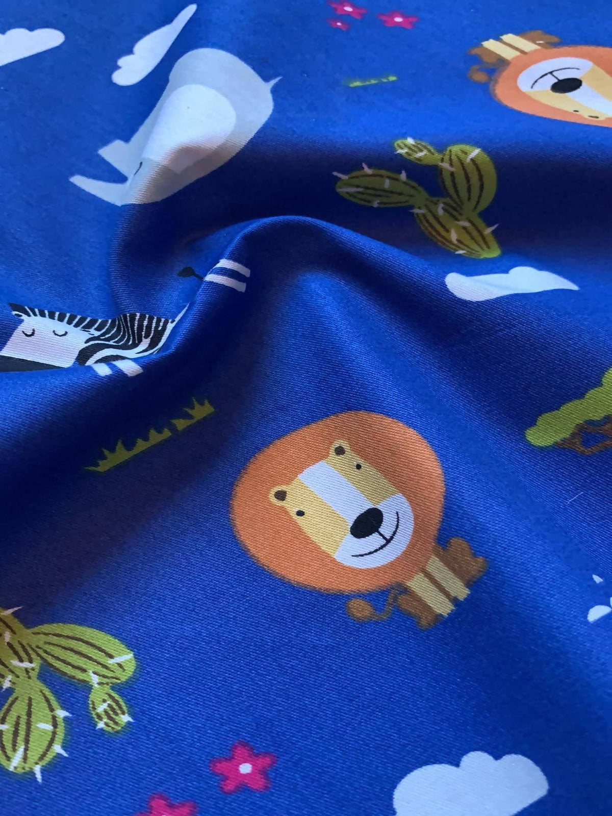 African Animal print on Royal Blue Cotton Sateen - Deadstock fabric on AmoThreads