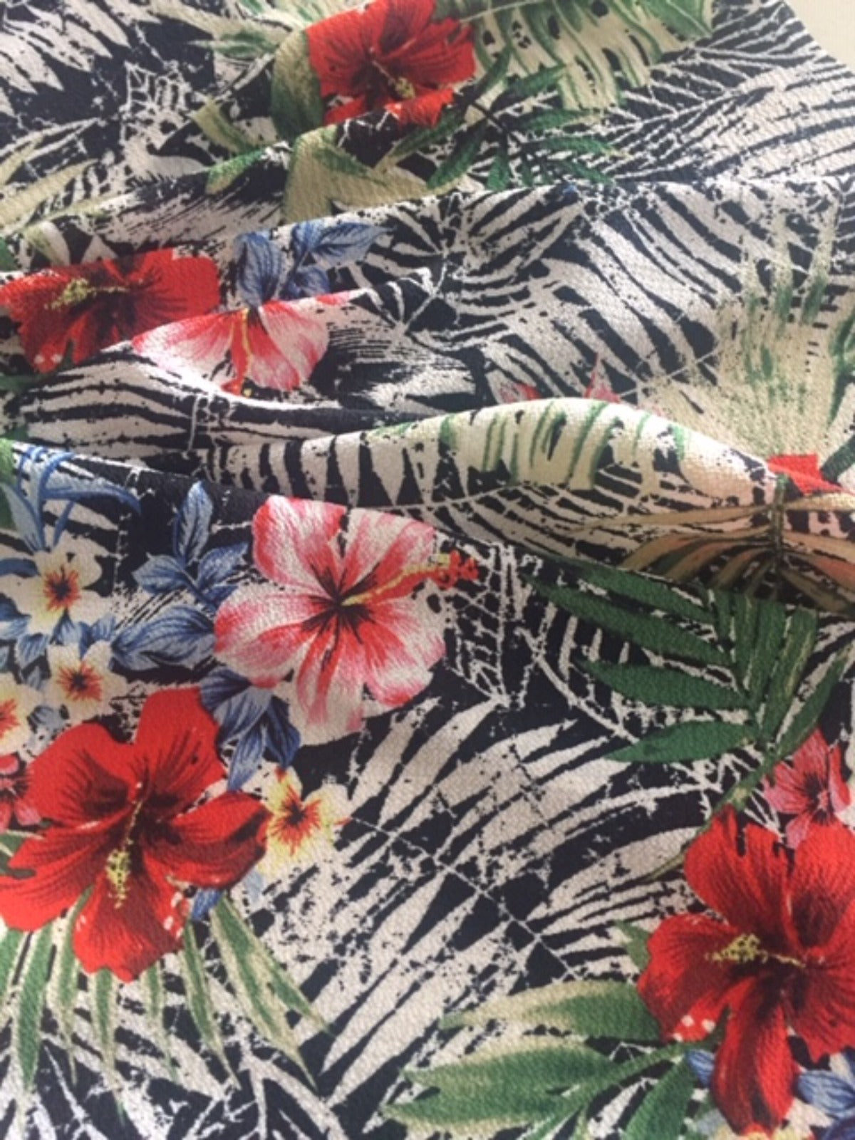Tropical Flowers on Black Fern Bubble Crepe Fabric