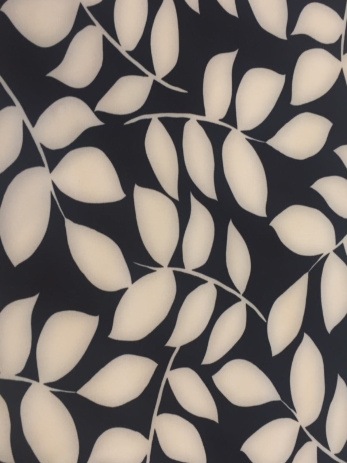 Ivory on Black Leaf Mono Print on Stretch Woven - Deadstock fabric on AmoThreads