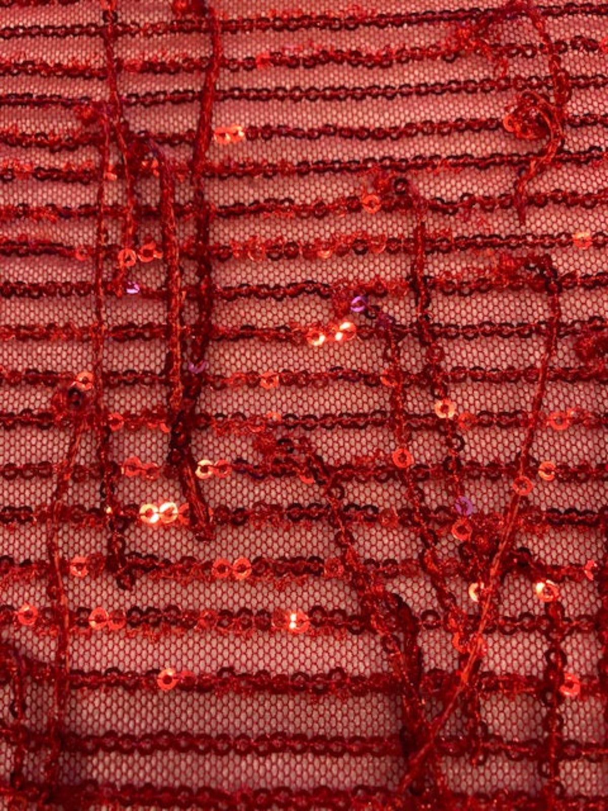 Red Sequin Tassel on Red Stretch Tulle. Tassels run across the piece.