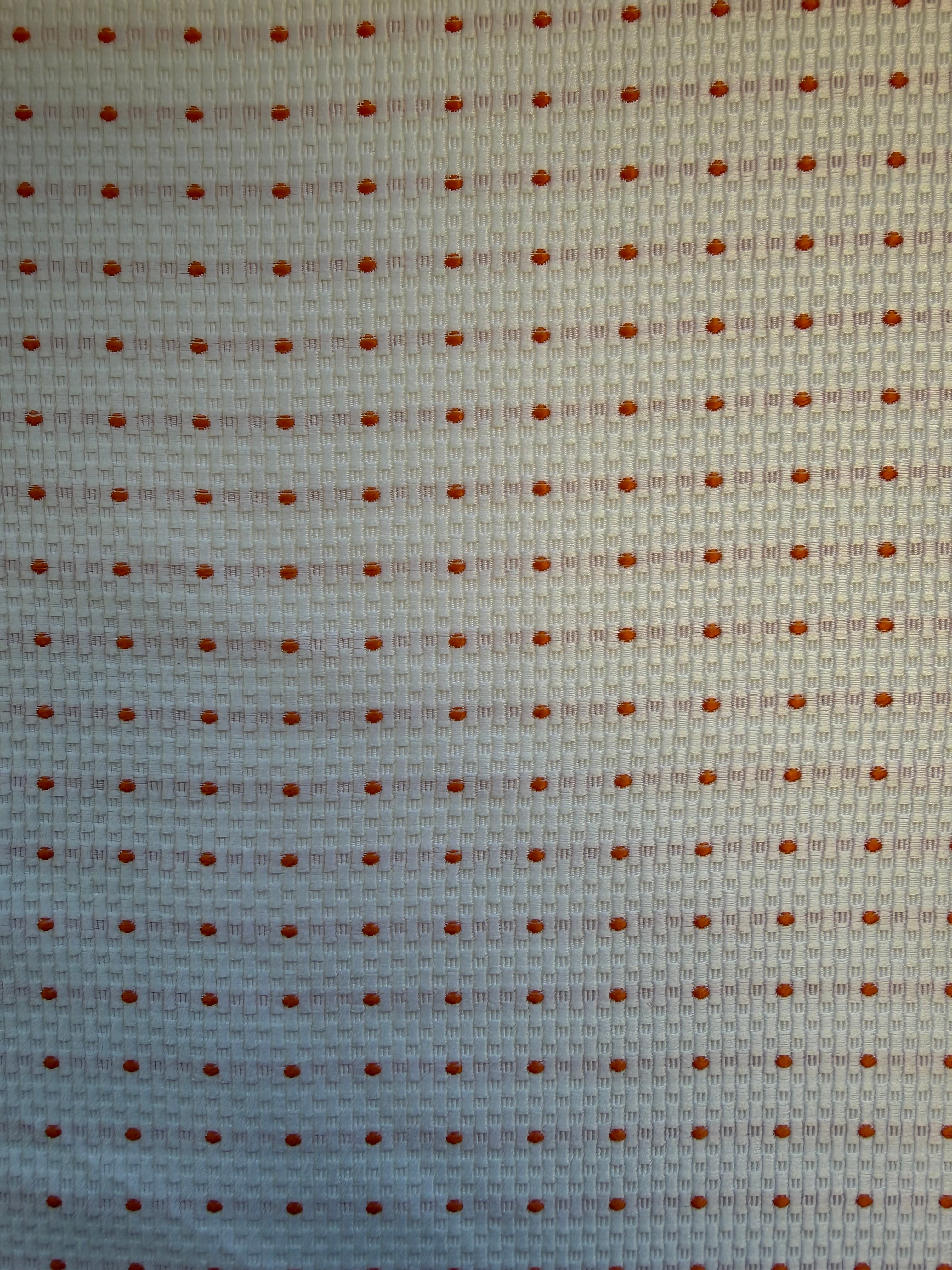 White Textured Woven Fabric with Orange Spots – 130 cm Wide