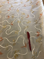 Glitter print on Ivory Crepe de Chine With Ribbon Swirl Overlay. 110g/m2, 100% Polyester. Roll Size: 2m