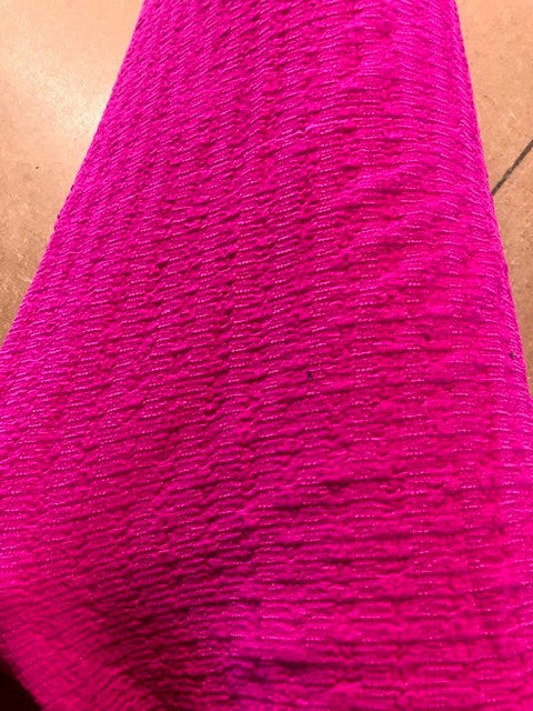 Bright Pink Textured Knit. 140g/m2, 98% Polyester 2%Elastane. Roll Size: 9m