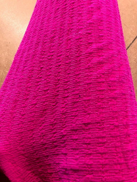 Bright Pink Textured Knit. 140g/m2, 98% Polyester 2%Elastane. Roll Size: 9m
