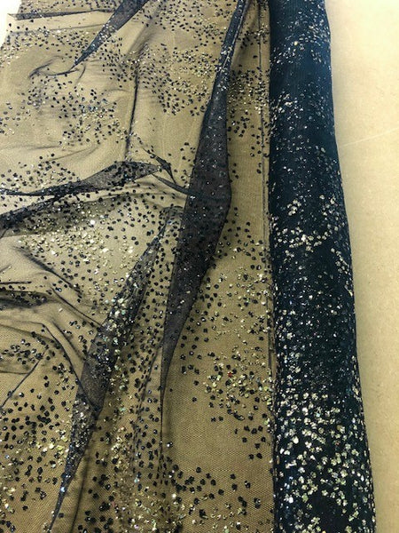 Gold Glitter on Black Tulle. 80g/m2, 100% Nylon. Roll Size: 3m