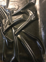 Black PVC Look on Knit. 200g/m2, 95% Polyester 5% Elastane. Roll Size: 4.5m.