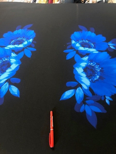Royal Floral Panels on Black Heavy Knit. Floral Panels at Irregular Intervals Along the Fabric. 240g/m2, 95% Polyester 5% Elastane. Roll Size: 7.7m