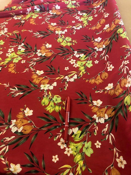 Lime Floral on Red Viscose. 130g/m2, 100% Viscose. Roll Size: 2.7m