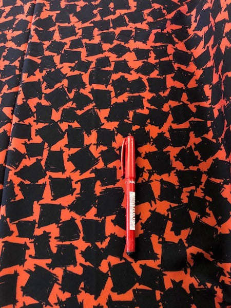 Orange/Black Abstract Block Print on Crepe. 180g/m2, 100% Polyester. Roll Size: 5.5m