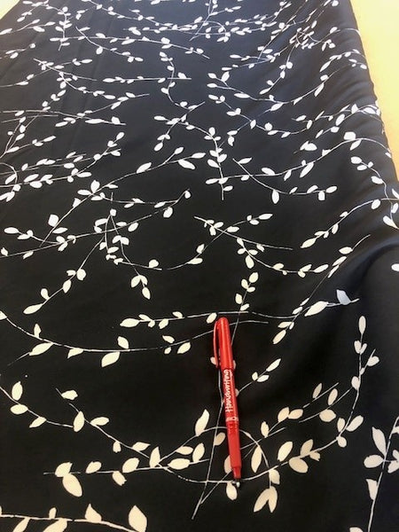 Dark Navy Trailing Leaf Print on Crepe de Chine. 100g/m2, 100% Polyester. Roll Size: 7m