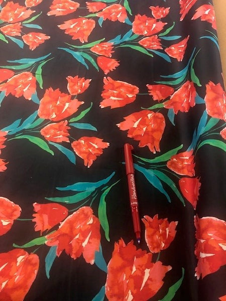 Red Floral on Black Cotton Sateen. 120g/m2, 100% Cotton. Roll Size: 2m