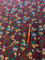 Orange Floral on Claret Cotton Poplin. 120 g/m2, 100% Cotton. 112cm Wide. Roll Size: 2m