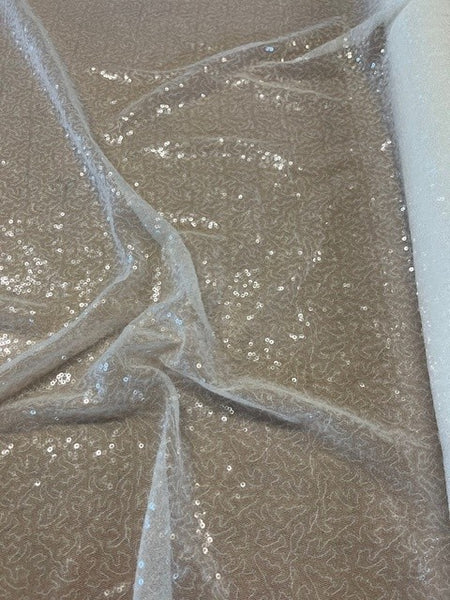 Ivory Allover Clear Sequin. 130g/m2, 100%Polyester. Roll Size: 1.2m