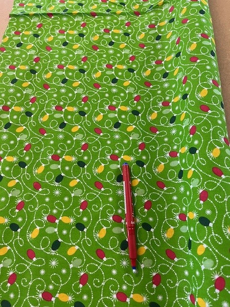 Christmas Baubles on Green Poly Cotton. 114cm 100g/m2, 65% Polyester 35% Cotton. Roll Size: 2.2m