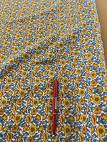 Orange/Blue Floral on Cotton. 110g/m2, 100% Cotton. Roll Size: 3.3m