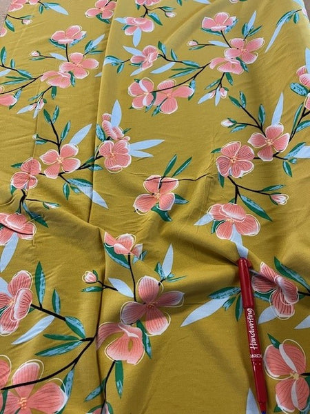 Coral on Mustard Floral. 110g/m2, 100% Viscose. Roll Size: 2.5m