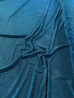 Teal Glitter on Jersey. 220g/m2, 95% Polyester 5% Elastane. Roll Size: 3.5m