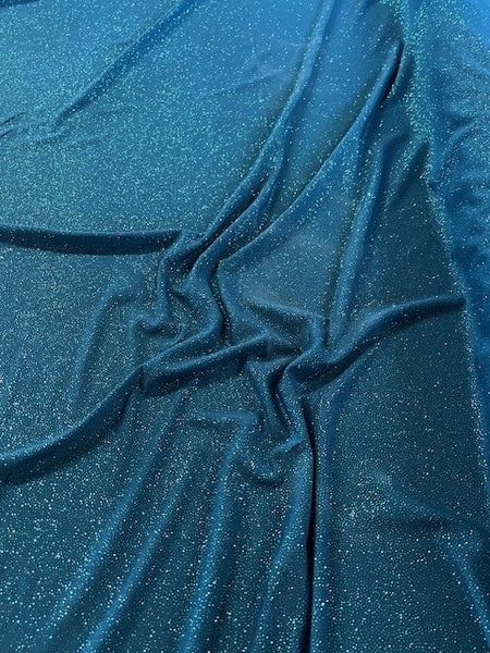 Teal Glitter on Jersey. 220g/m2, 95% Polyester 5% Elastane. Roll Size: 3.5m