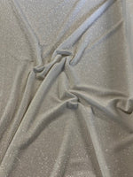 Ivory Glitter on Jersey. 220g/m2, 95% Polyester 5% Elastane. Roll Size: 3m