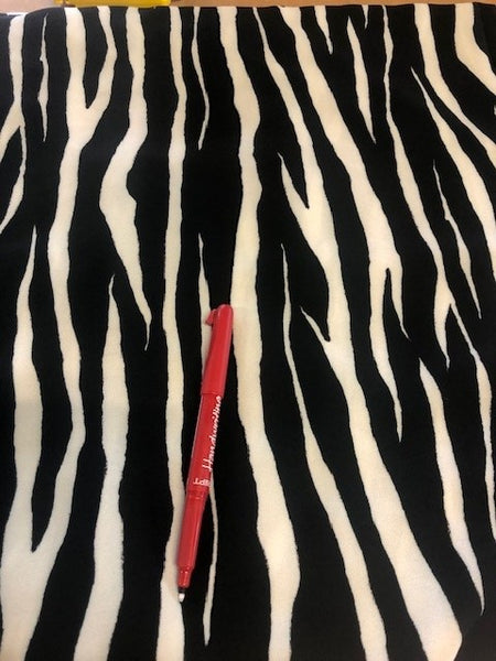 Black/Ivory Zebra Stripe on Crepe. 100% Polyester. 170g/m2. rOLL sIZE - 3.5M