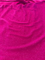 Fuchsia Allover Flitter on Jersey. 220g/m2. 95% Polyester 5% Elastane. Roll Size - 2m