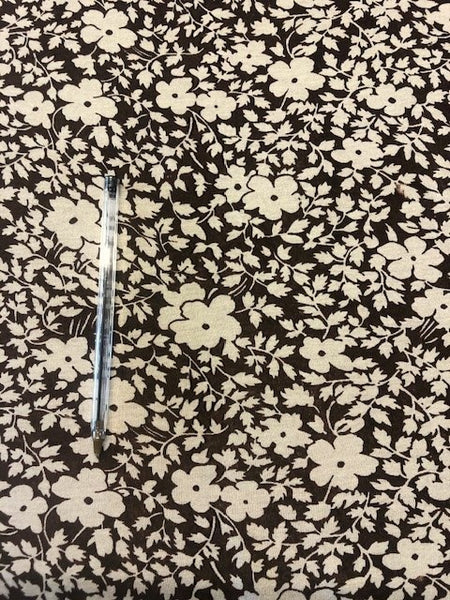 Ivory Flower Print on Brown.  100% Viscose. 155cm.  Roll Size 6.8m.