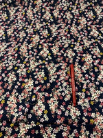 Pink Ditzy on Navy Cotton Lawn. 110g/m2. Roll Size - 3.5m