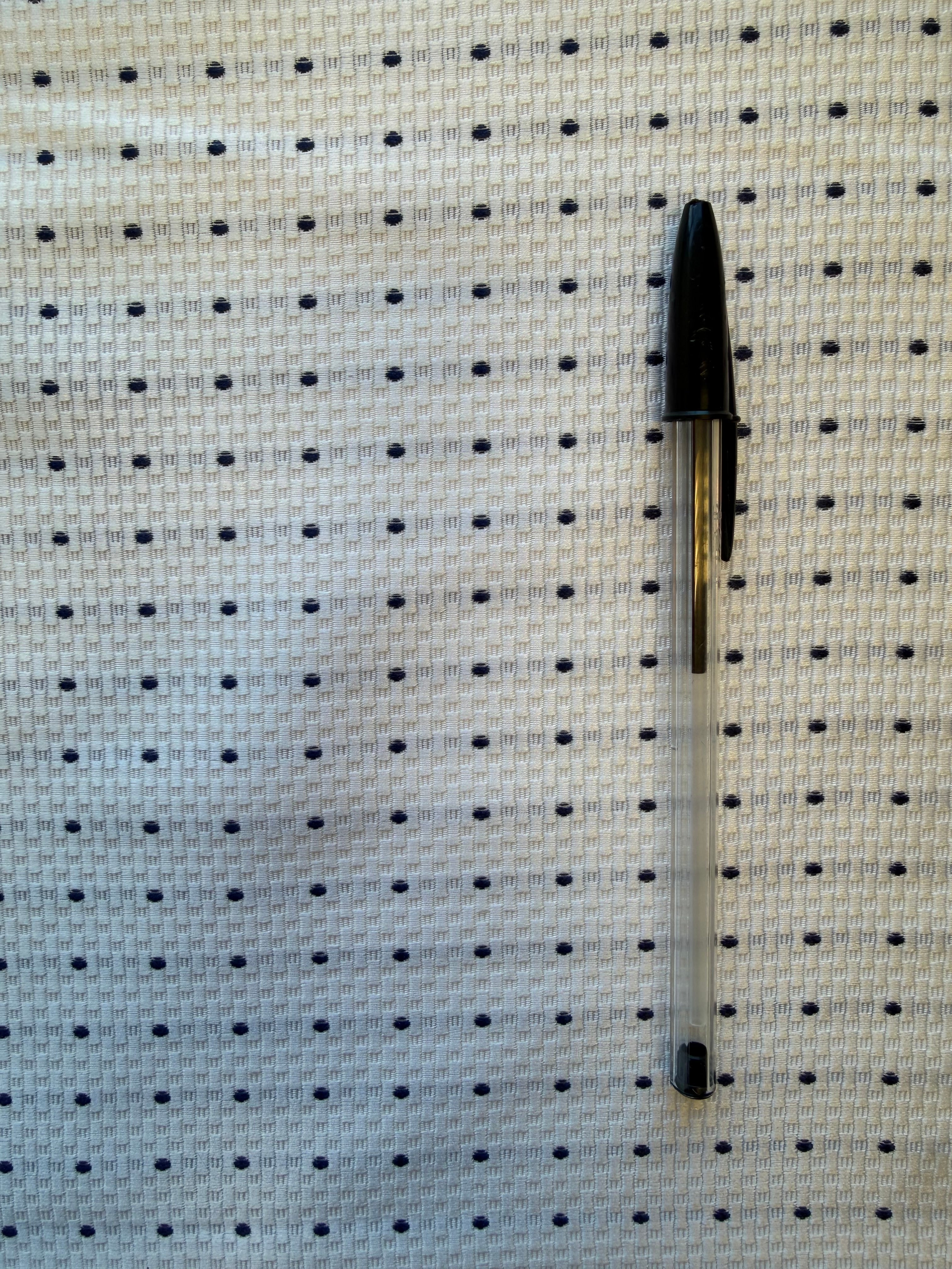 White Textured Woven Fabric with Navy Spot – 130 cm Wide